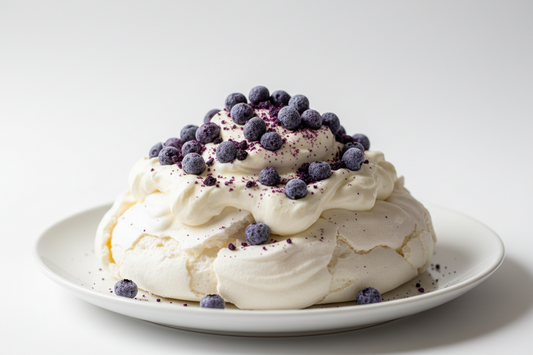 Pavlova topped with freeze-dried blueberries and strawberries