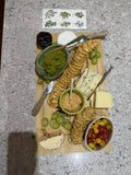 Prepared guacamole dip served with a cheese and snack platter