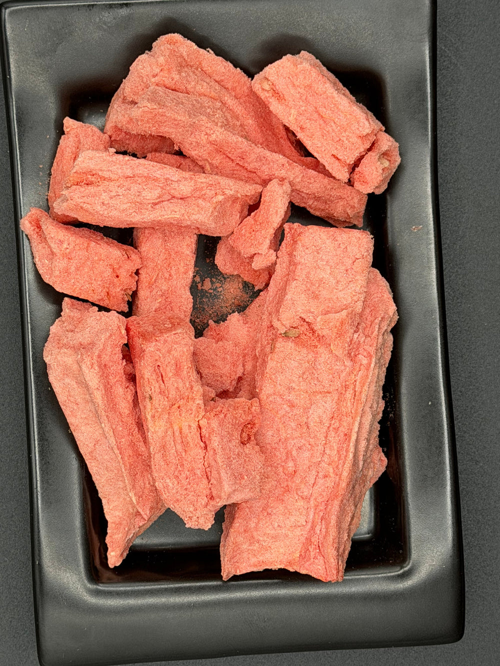 Fresh watermelon beside freeze-dried watermelon pieces