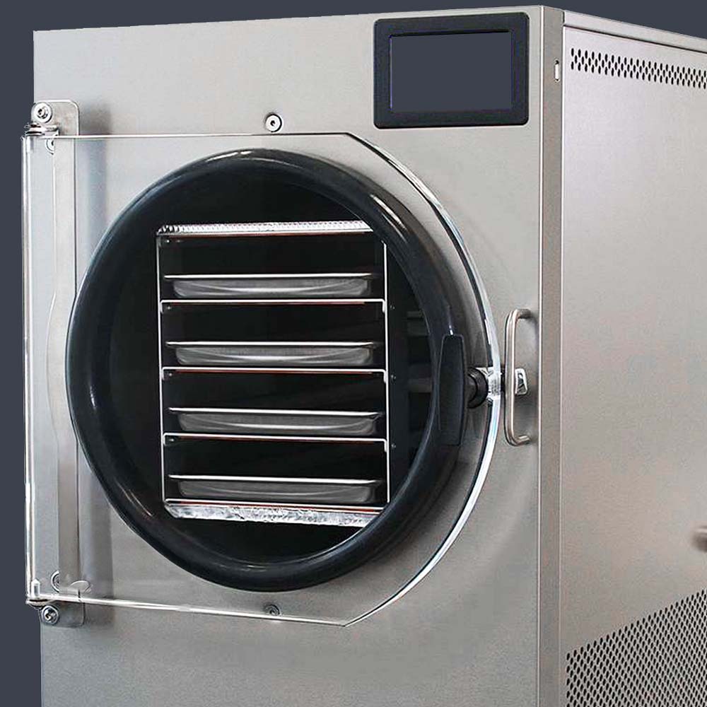 A large and empty metallic industrial freeze-drying machine